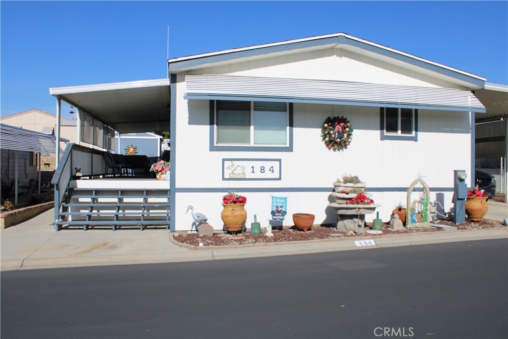 1010 Terrace Road, Unit 184 San Bernardino, CA 92410 - Photo 2 of 2 a view of a building with car parked