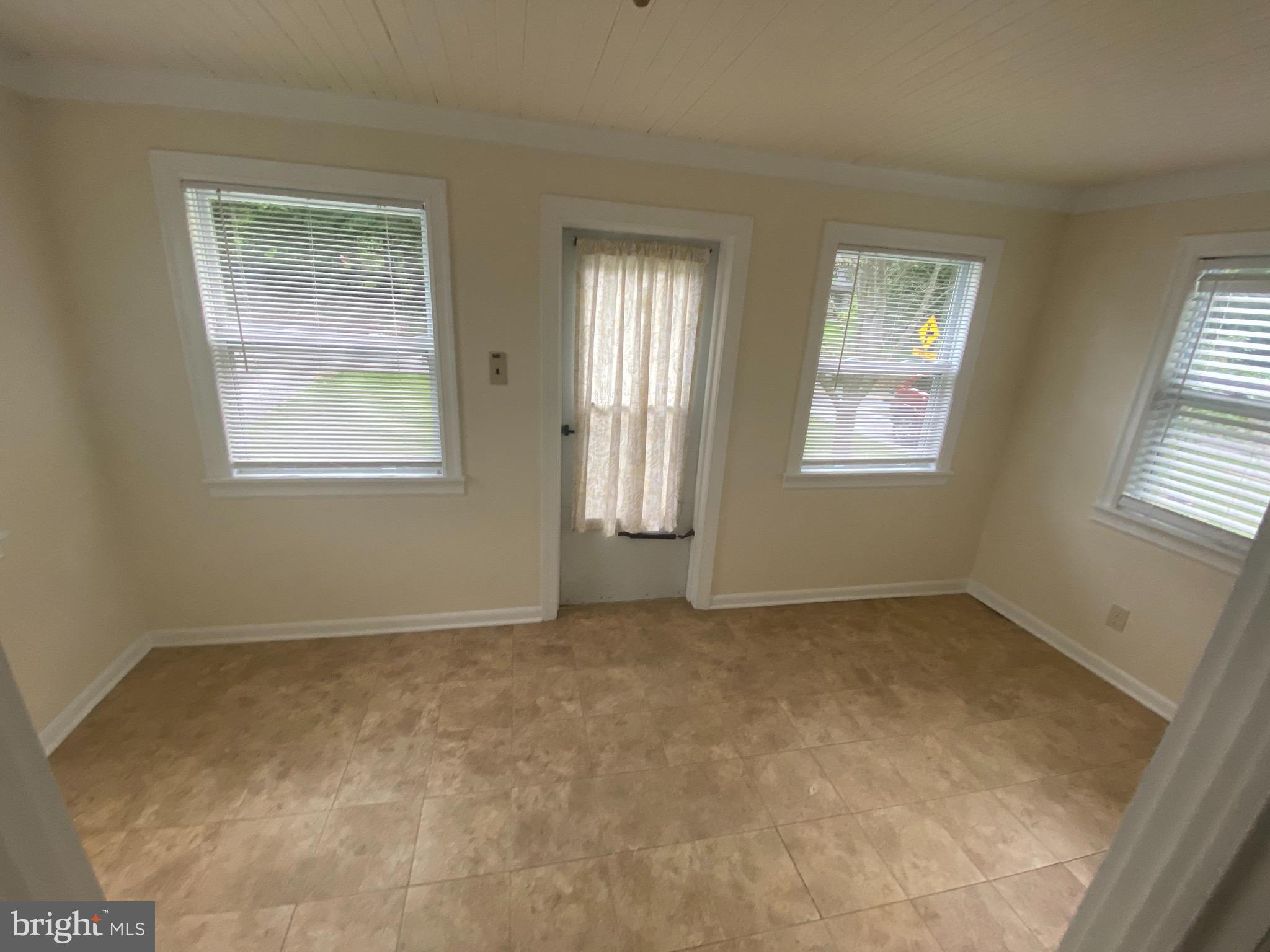 959 Radnor Road Wayne, PA 19087 - Photo 29 of 35 Enclosed porch has tile floor
