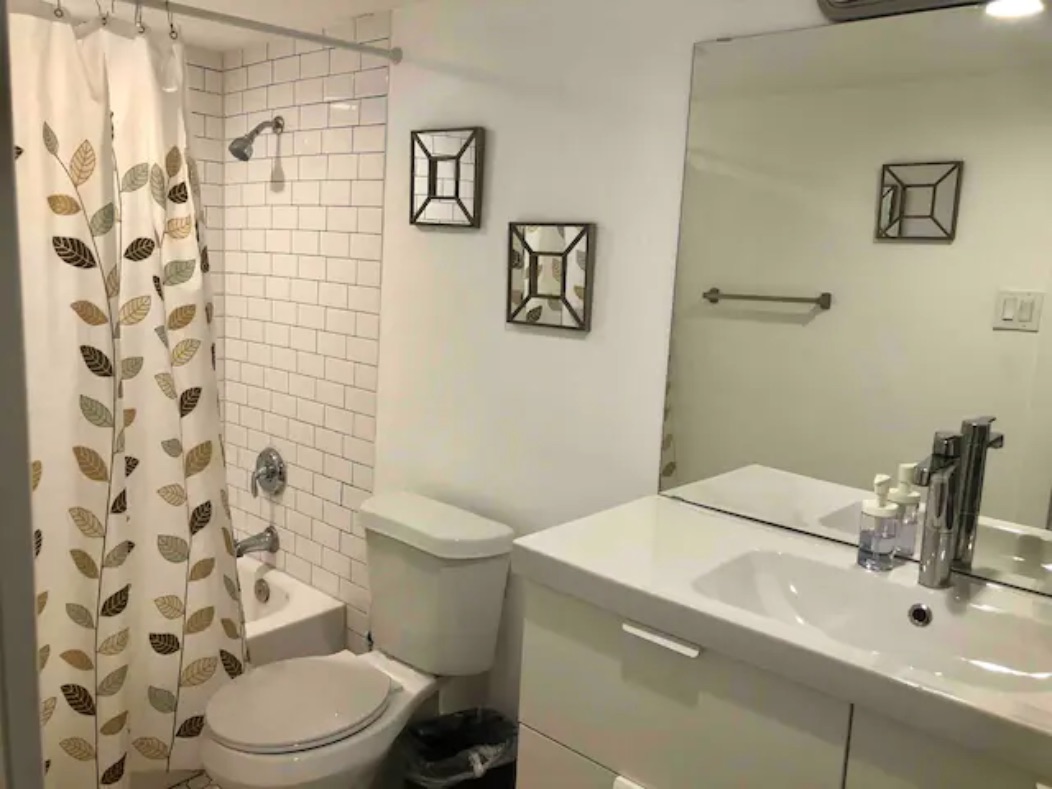 5909 Bolm Road, Unit 13 Austin, TX 78721 - Photo 4 of 10 Full bath featuring shower / bath combo with shower curtain and vanity