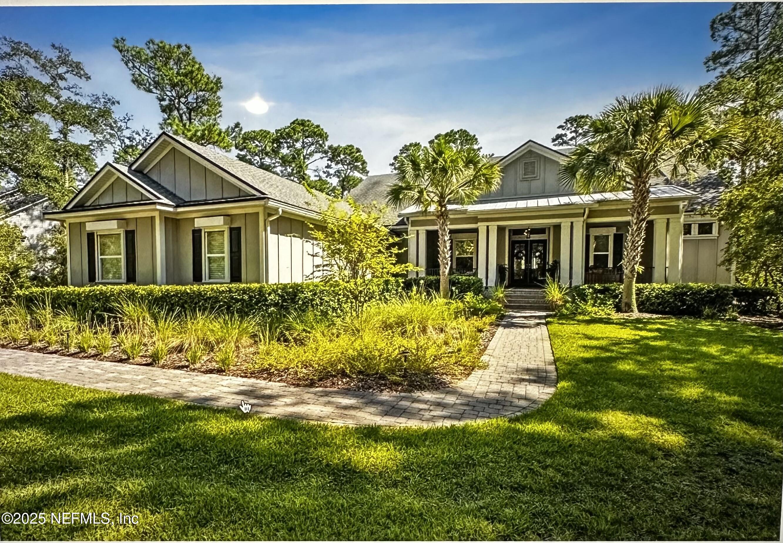 96220 Brady Point Road Fernandina Beach, FL 32034 - Photo 1 of 1 a front view of a house with a yard