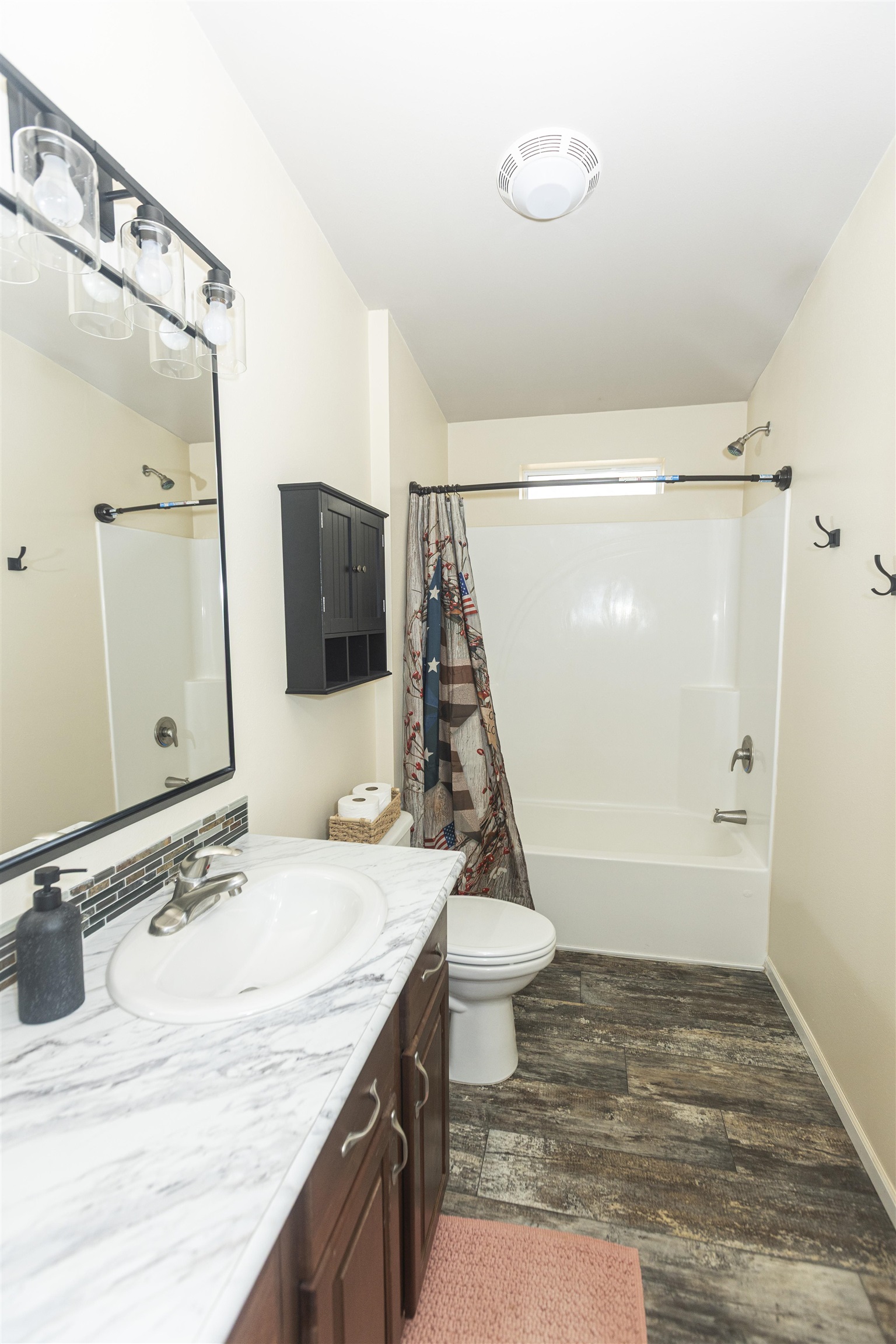 2432 Pioneer Way Rifle, CO 81650 - Photo 15 of 31 a bathroom with a sink double vanity and shower