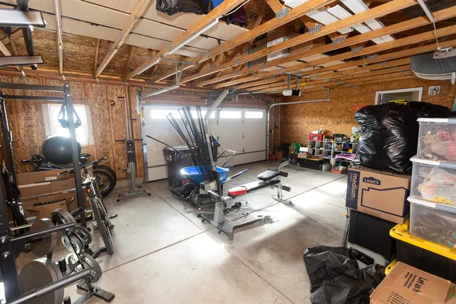 a bedroom with a bed window and couch