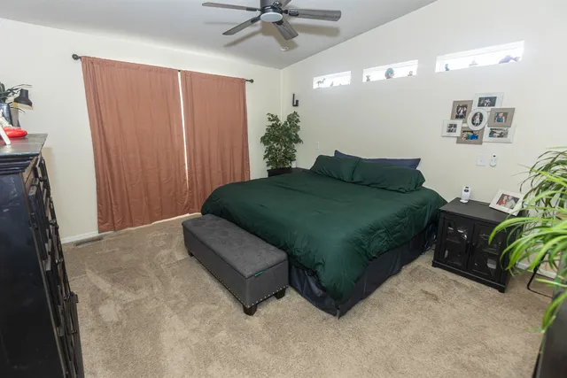 a bedroom with a bed and a dresser