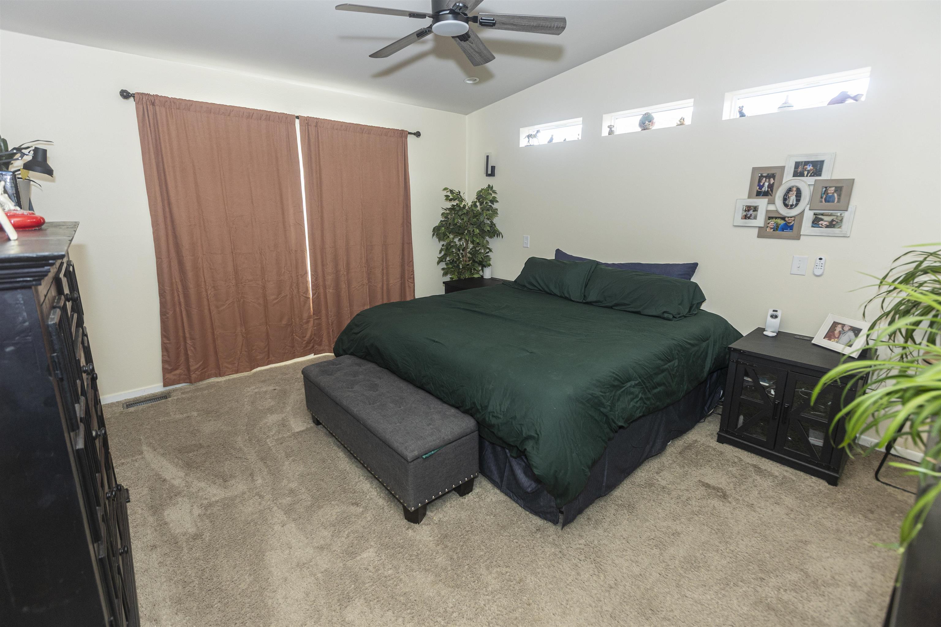 2432 Pioneer Way Rifle, CO 81650 - Photo 20 of 31 a bedroom with a bed window and couch