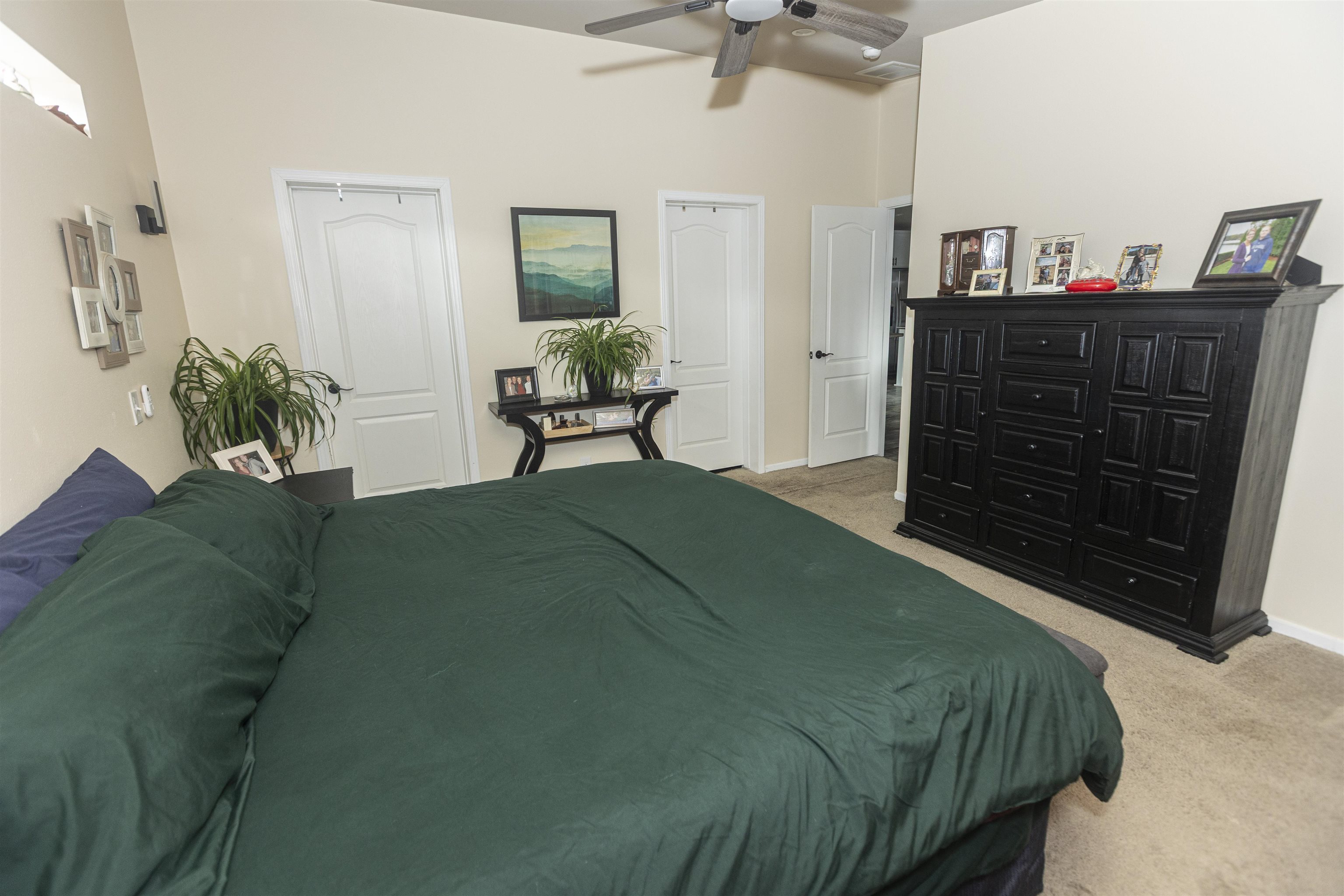 2432 Pioneer Way Rifle, CO 81650 - Photo 21 of 31 a bedroom with a bed and a dresser