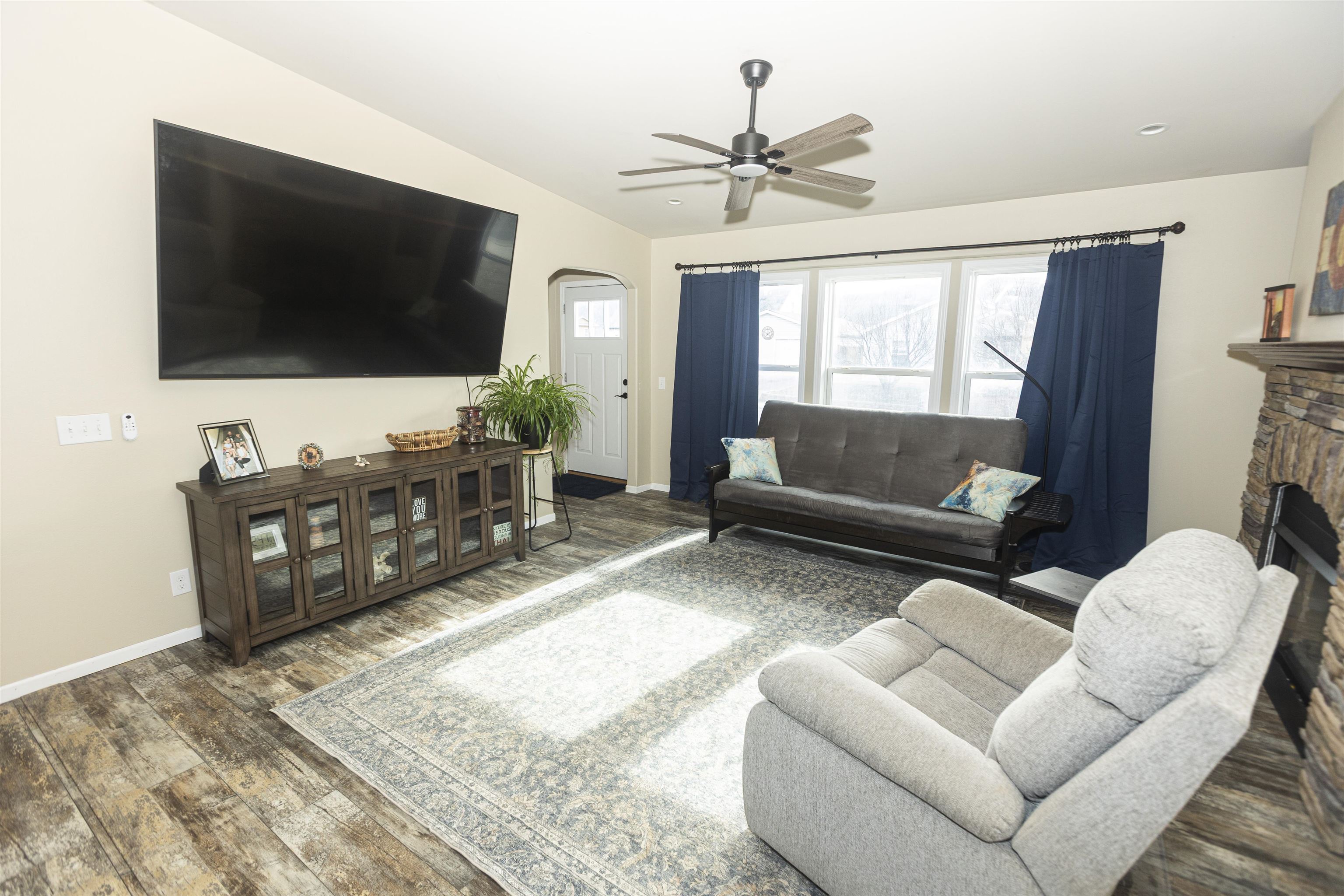2432 Pioneer Way Rifle, CO 81650 - Photo 5 of 31 a living room with furniture and a flat screen tv