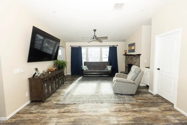 a view of a kitchen with kitchen island dining table and stainless steel appliances