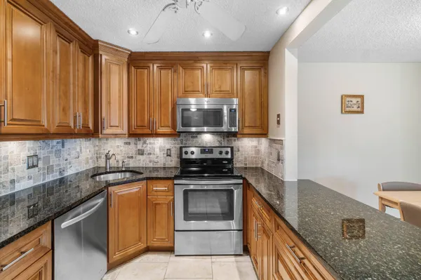 a living room with granite countertop furniture and a window