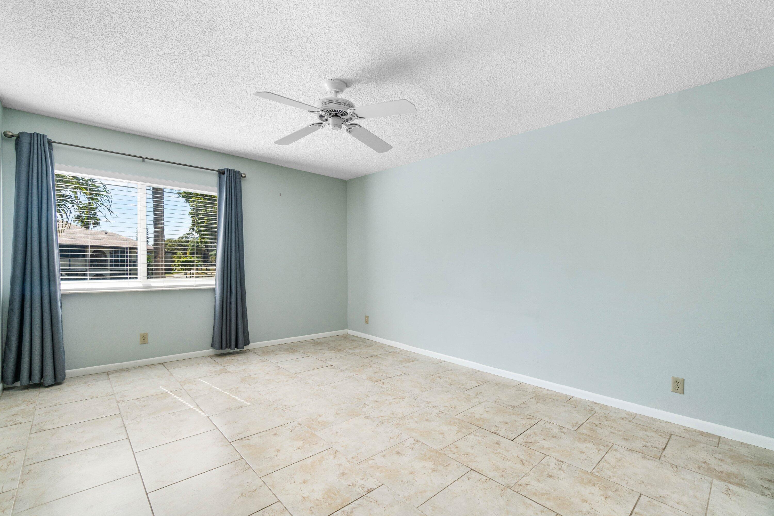 322 Pine Ridge Circle, Unit A2 Greenacres, FL 33463 - Photo 18 of 26 a view of an empty room with a window