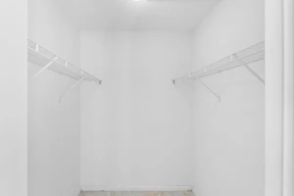 a bathroom with a granite countertop sink a large mirror and a