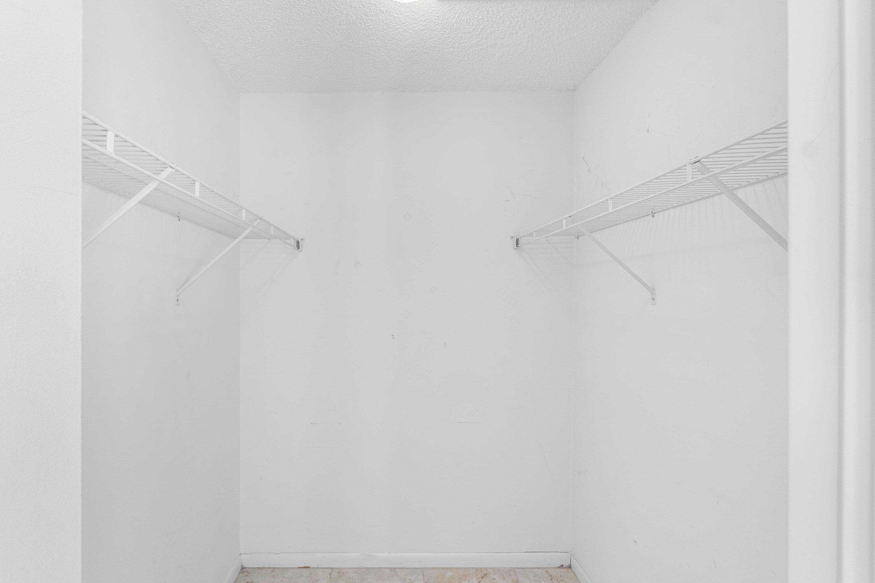 322 Pine Ridge Circle, Unit A2 Greenacres, FL 33463 - Photo 20 of 26 a view of small space with racks on the wall