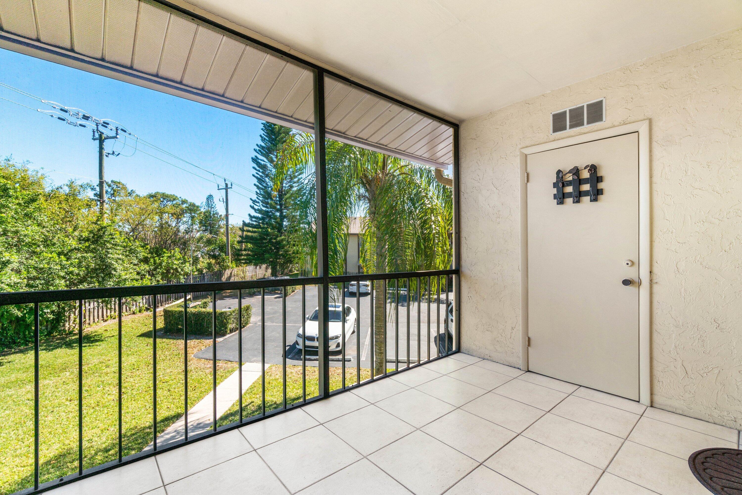 322 Pine Ridge Circle, Unit A2 Greenacres, FL 33463 - Photo 25 of 26 a view of a city from a balcony