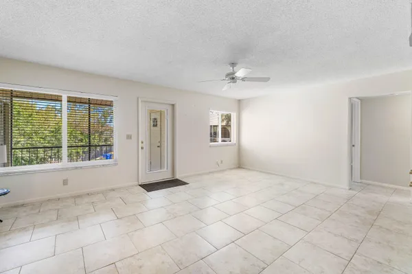 a view of an empty room with a window