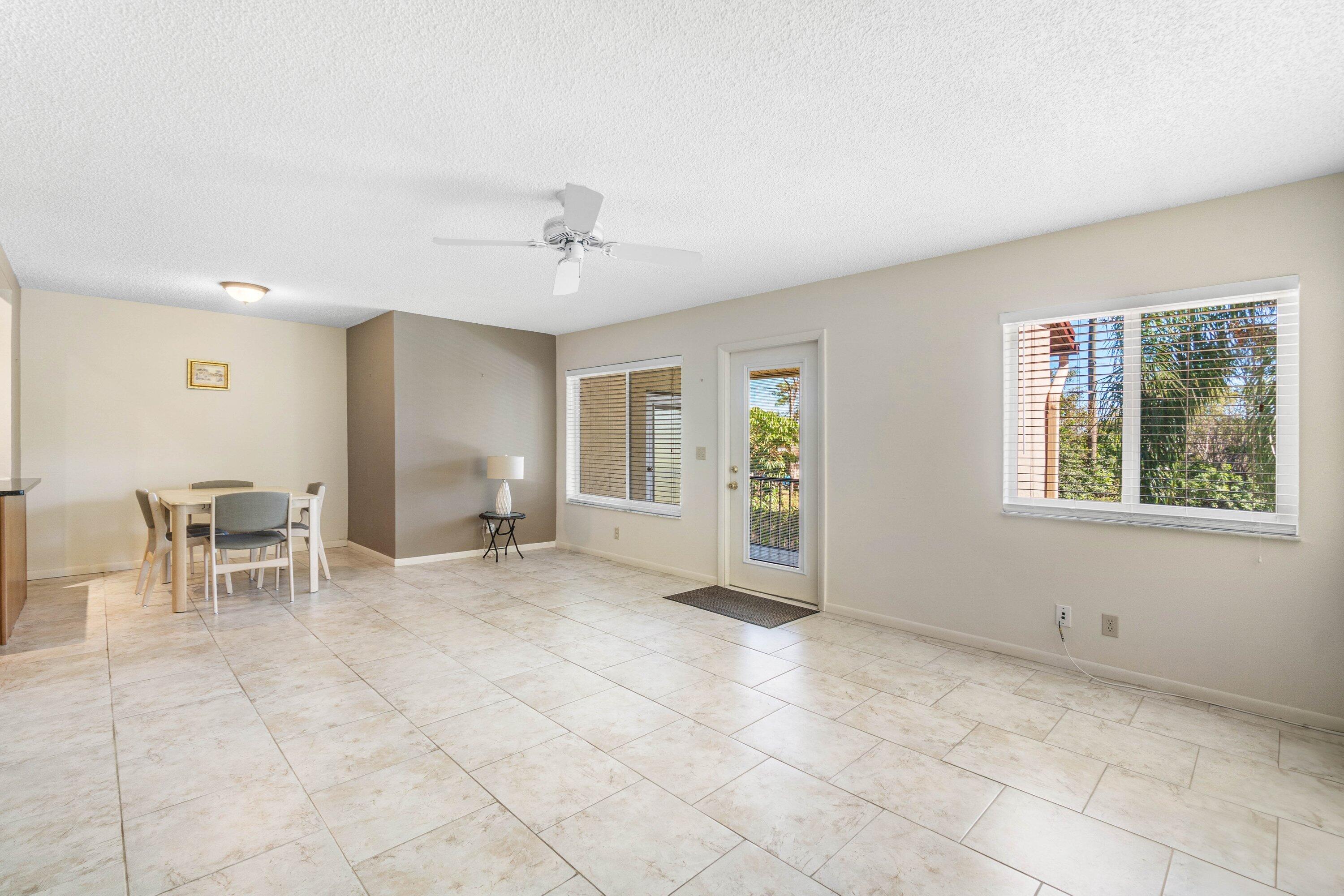 322 Pine Ridge Circle, Unit A2 Greenacres, FL 33463 - Photo 6 of 26 a view of a livingroom with furniture and window
