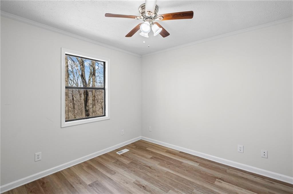 764 Chestnut Cove Trail Jasper, GA 30143 - Photo 21 of 44 an empty room with a window and a fan