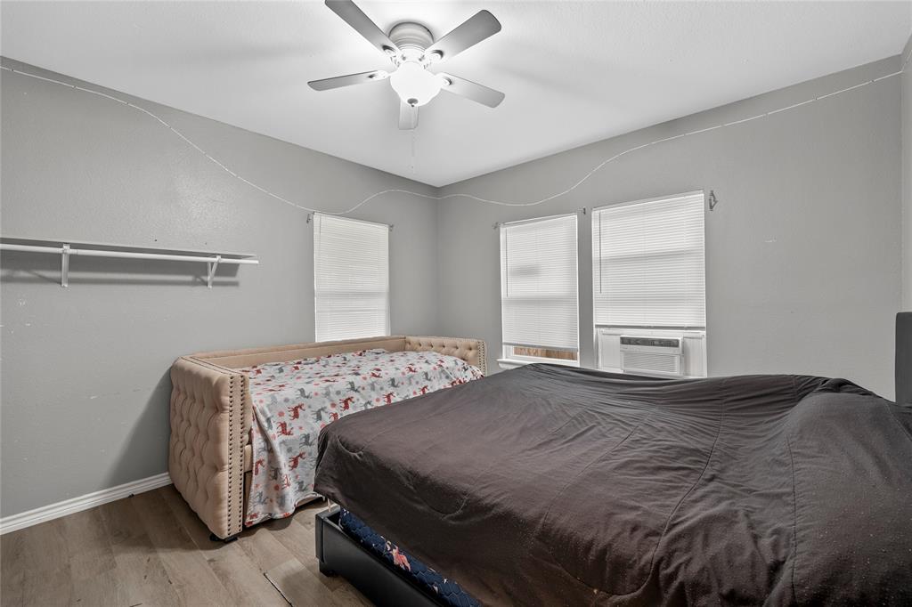 2301 Herring Avenue Waco, TX 76708 - Photo 12 of 14 a bedroom with a bed and window