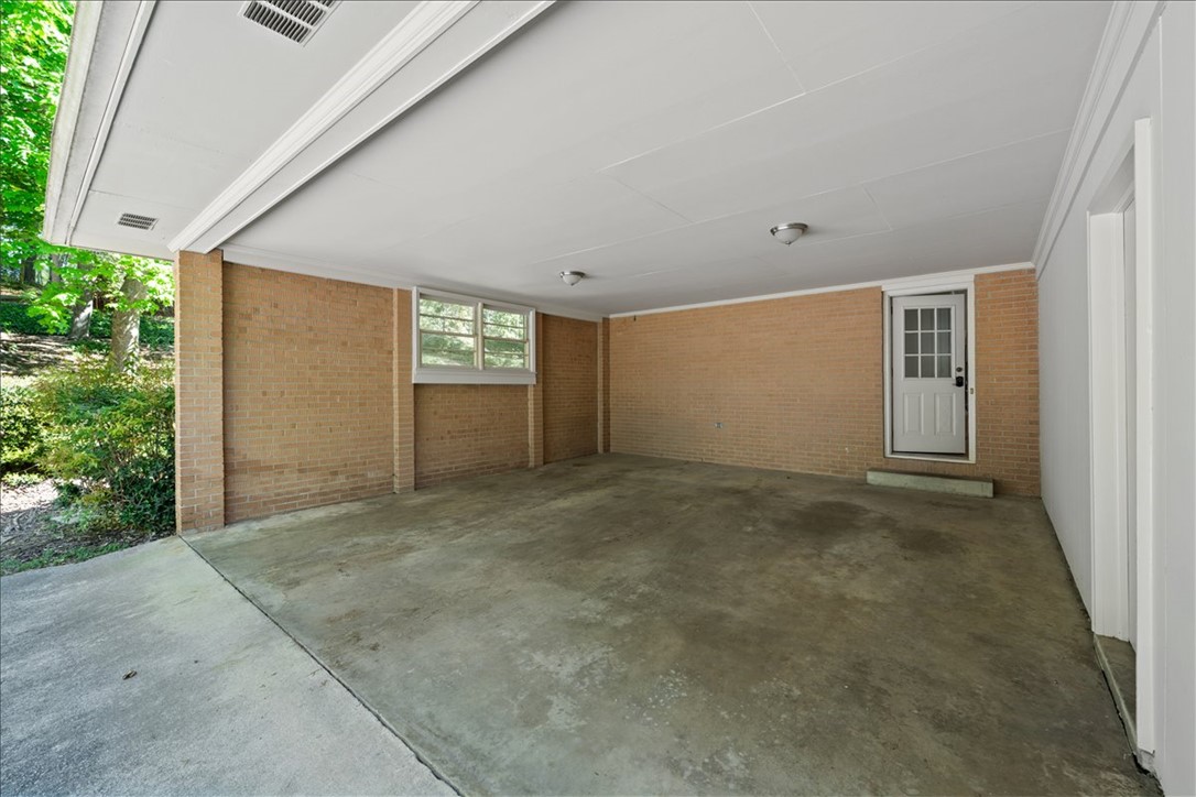 103 Satula Lane Clemson, SC 29631 - Photo 43 of 50 This spacious carport offers practical outdoor shelter with easy home access.