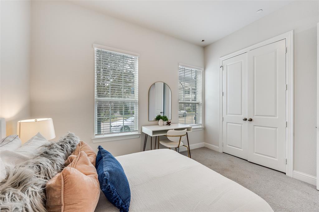 1036 Drew Lane Allen, TX 75013 - Photo 16 of 38 a bedroom with a bed a table and windows