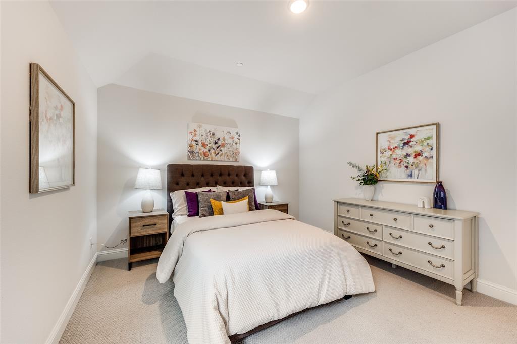 1036 Drew Lane Allen, TX 75013 - Photo 18 of 38 a bedroom with a bed and a cabinets