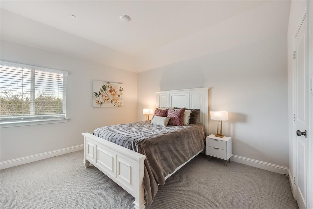 1036 Drew Lane Allen, TX 75013 - Photo 19 of 38 a spacious bedroom with a bed and window