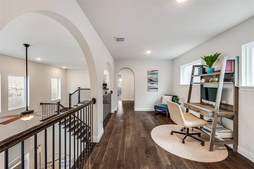 1036 Drew Lane Allen, TX 75013 - Photo 20 of 38 a workspace with furniture wooden floor and a chandelier