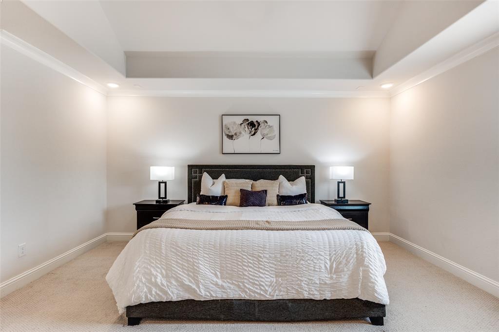 1036 Drew Lane Allen, TX 75013 - Photo 24 of 38 a bedroom with a bed and painting on the wall