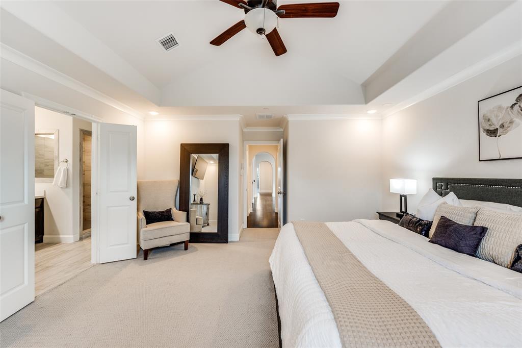 1036 Drew Lane Allen, TX 75013 - Photo 26 of 38 a bedroom with a bed and gym equipment