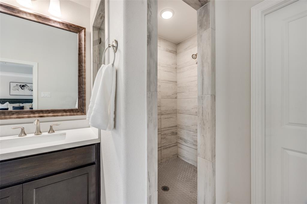 1036 Drew Lane Allen, TX 75013 - Photo 29 of 38 a bathroom with a sink and a mirror