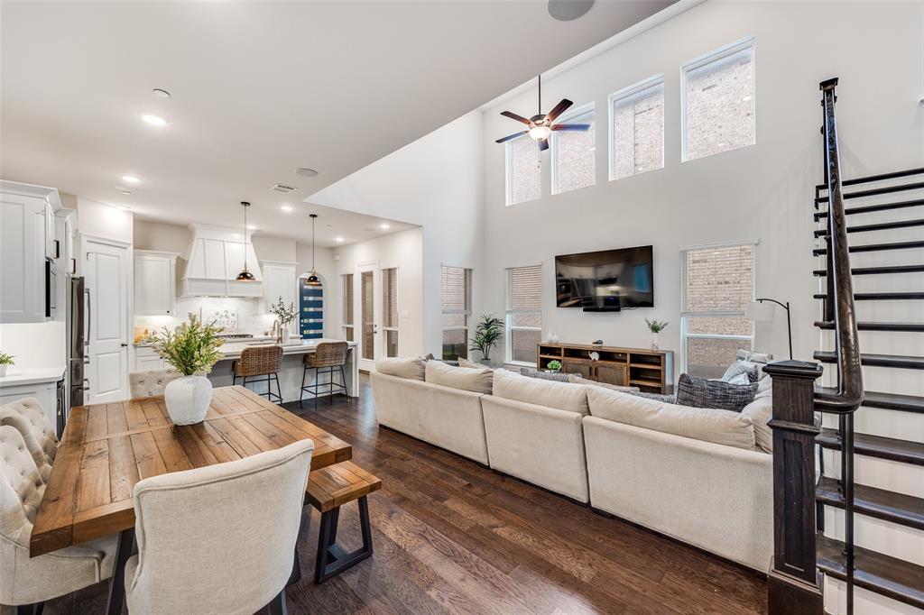 1036 Drew Lane Allen, TX 75013 - Photo 7 of 38 a living room with furniture a flat screen tv and kitchen view