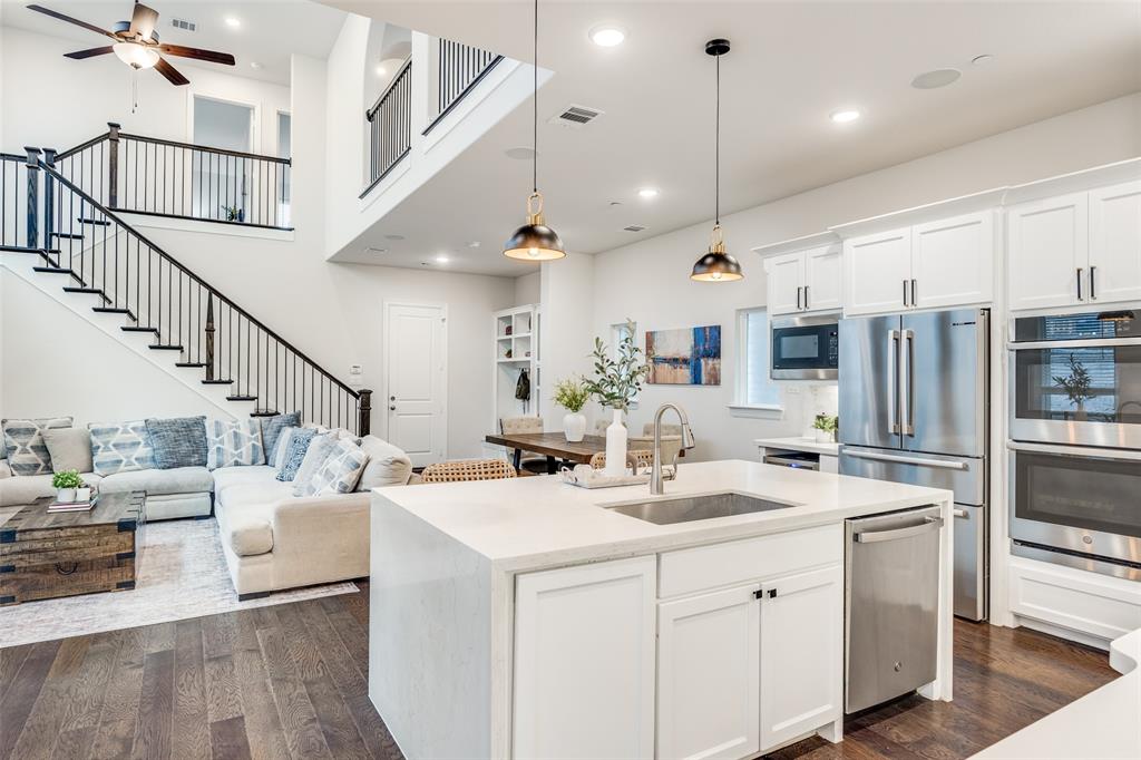 1036 Drew Lane Allen, TX 75013 - Photo 8 of 38 a kitchen with sink stove and white cabinets