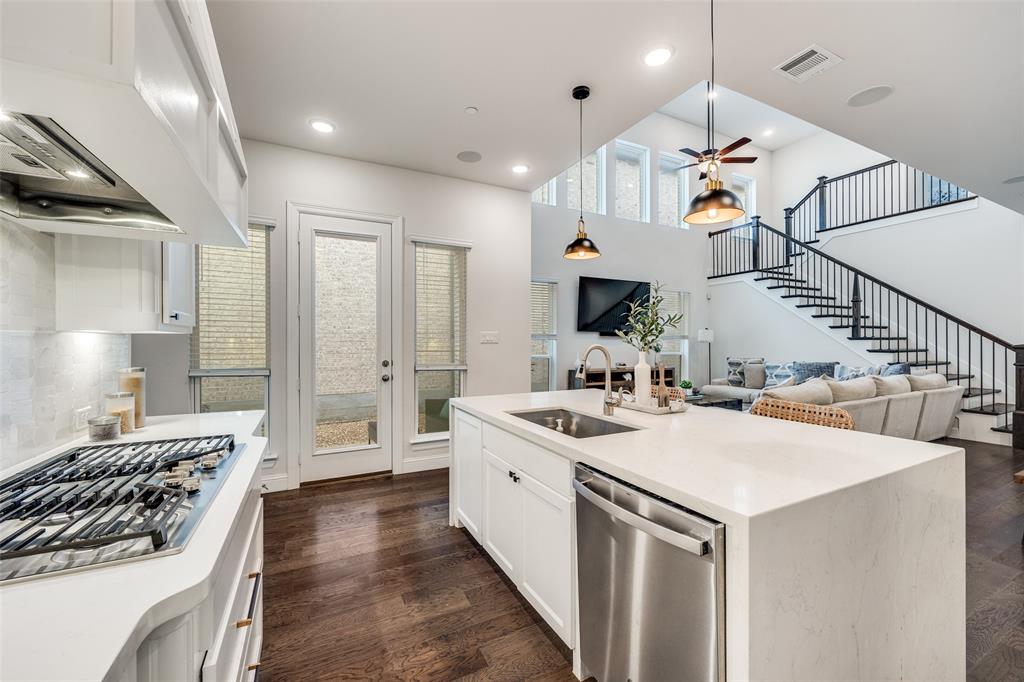 1036 Drew Lane Allen, TX 75013 - Photo 9 of 38 a kitchen with a sink a stove and chairs