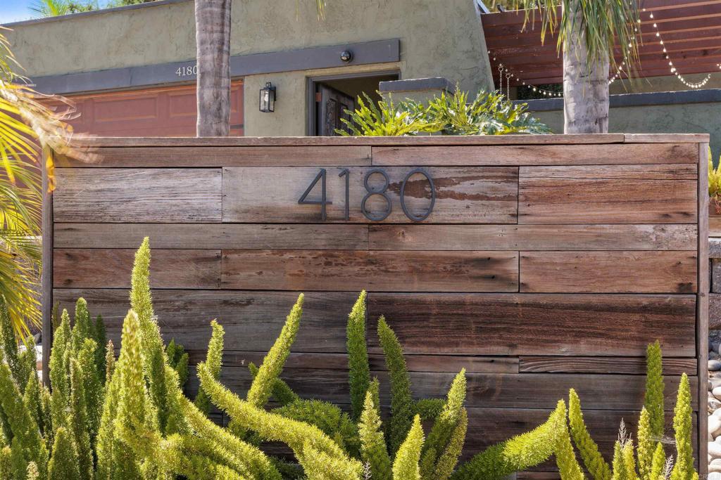 4180 Galbar Place Oceanside, CA 92056 - Photo 2 of 41 a front view of a house with a garden