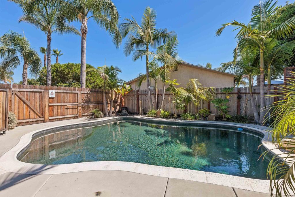 4180 Galbar Place Oceanside, CA 92056 - Photo 25 of 41 a view of swimming pool with a garden and trees