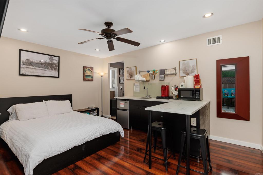 4180 Galbar Place Oceanside, CA 92056 - Photo 28 of 41 a bedroom with a bed and a desk