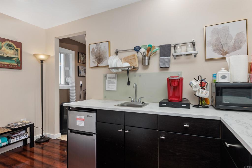 4180 Galbar Place Oceanside, CA 92056 - Photo 30 of 41 a bathroom with a sink double vanity and a shower
