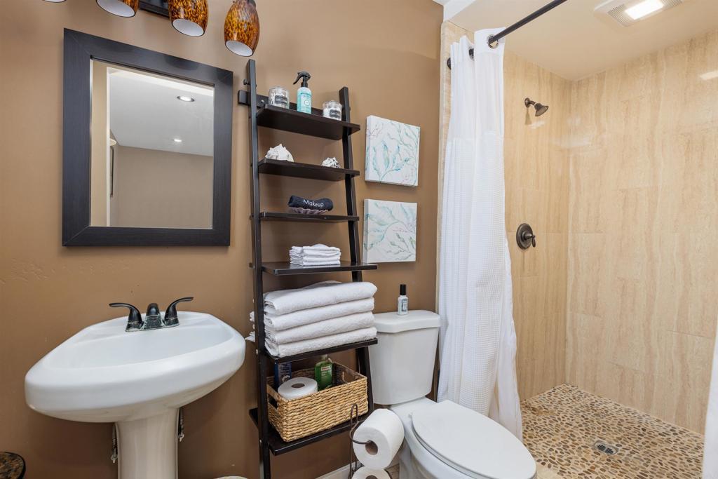 4180 Galbar Place Oceanside, CA 92056 - Photo 31 of 41 a bathroom with a sink toilet and shower
