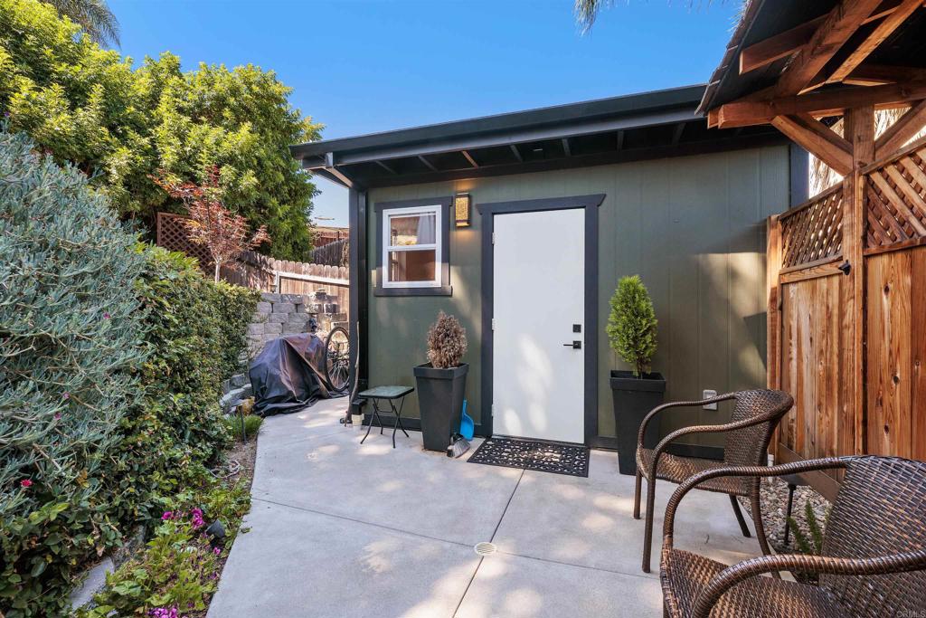 4180 Galbar Place Oceanside, CA 92056 - Photo 32 of 41 a backyard of a house with table and chairs