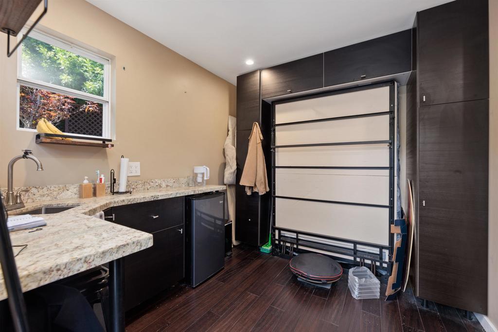 4180 Galbar Place Oceanside, CA 92056 - Photo 34 of 41 a kitchen with a sink appliances and wooden floor