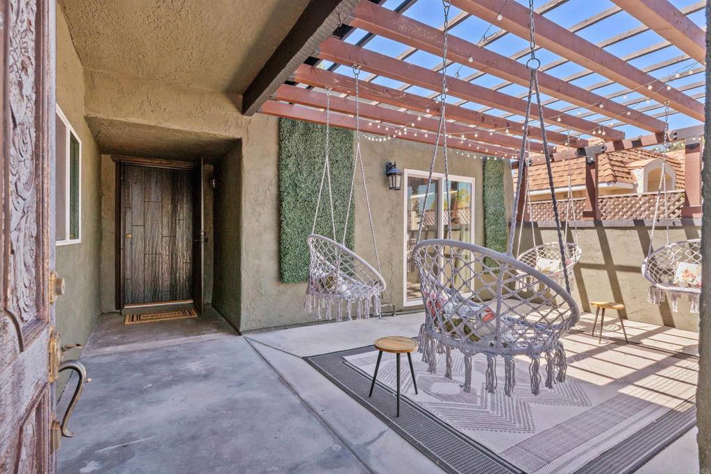 4180 Galbar Place Oceanside, CA 92056 - Photo 4 of 41 a view of a patio with table and chairs