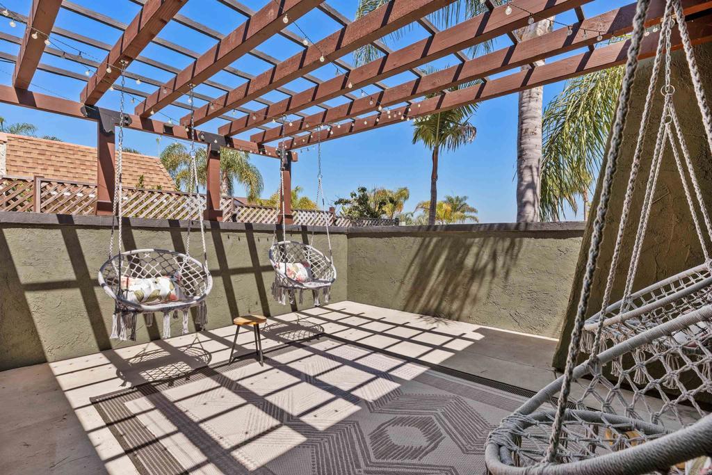 4180 Galbar Place Oceanside, CA 92056 - Photo 5 of 41 a view of a balcony with chairs and wooden fence