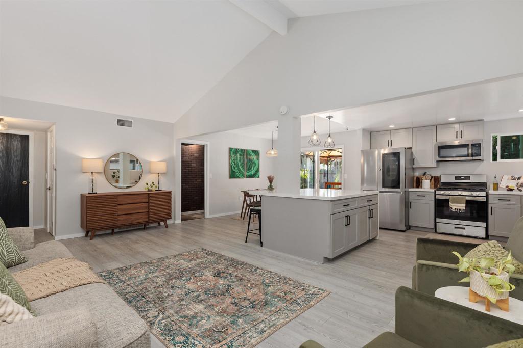 4180 Galbar Place Oceanside, CA 92056 - Photo 10 of 41 a kitchen with furniture a stove a sink and a refrigerator
