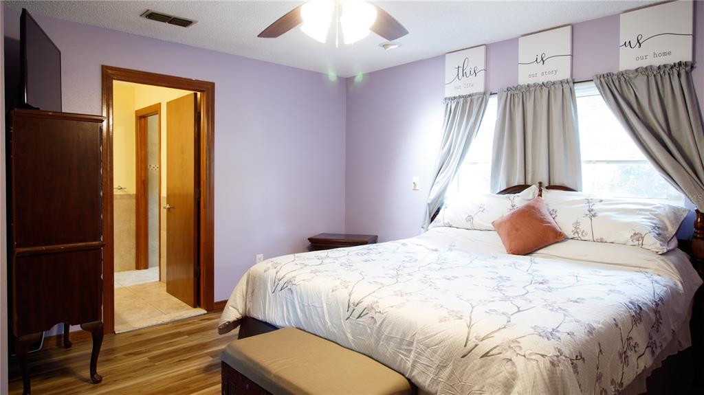 1357 Dinsmore Court New Port Richey, FL 34655 - Photo 38 of 60 a bedroom with a bed and a window