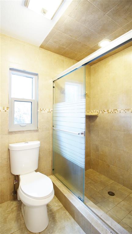 1357 Dinsmore Court New Port Richey, FL 34655 - Photo 41 of 60 a bathroom with a toilet and shower