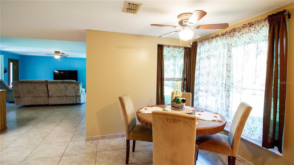 1357 Dinsmore Court New Port Richey, FL 34655 - Photo 49 of 60 a view of a dining room with furniture window and outside view