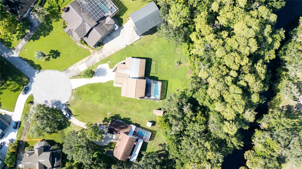 1357 Dinsmore Court New Port Richey, FL 34655 - Photo 56 of 60 an aerial view of a house with a yard