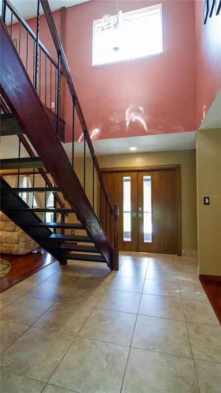 1357 Dinsmore Court New Port Richey, FL 34655 - Photo 6 of 60 a view of entryway and hall with wooden floor
