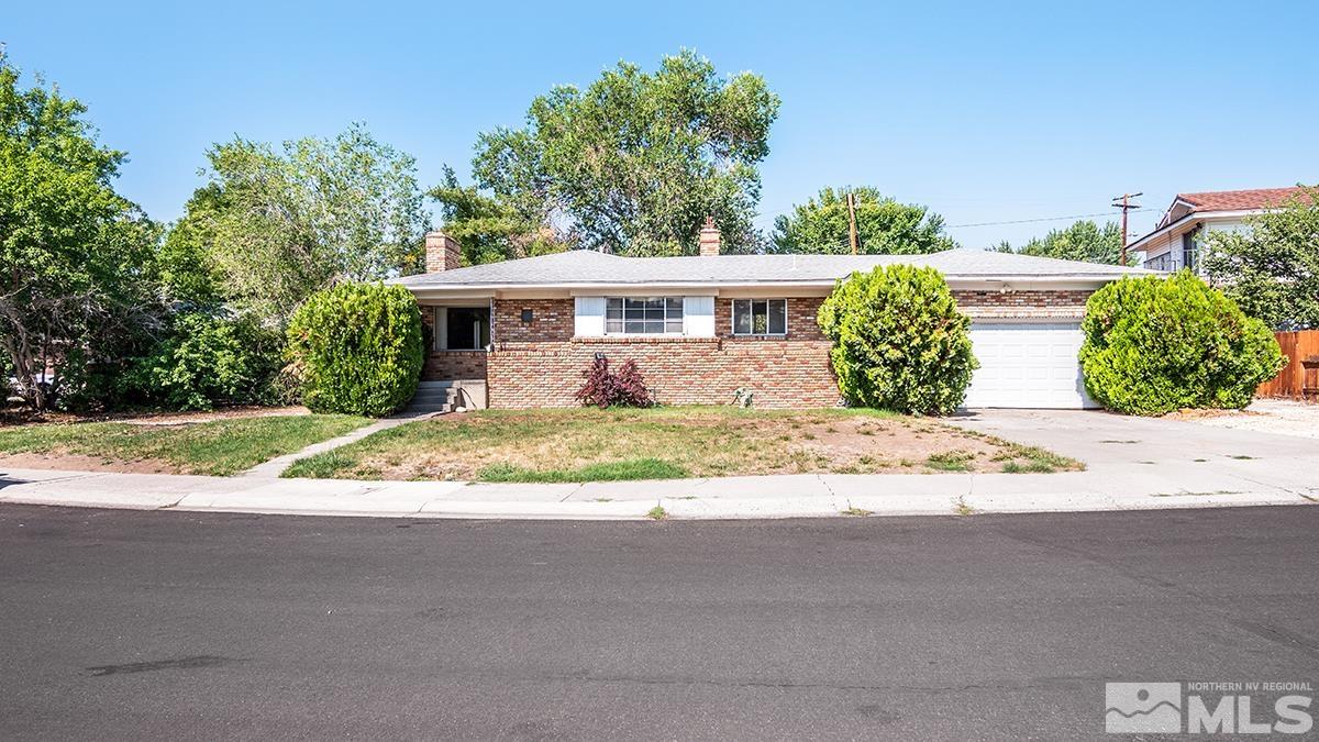 735 Brookfield Drive Reno, NV 89503 - Photo 1 of 23 a front view of a house with a yard and potted plants