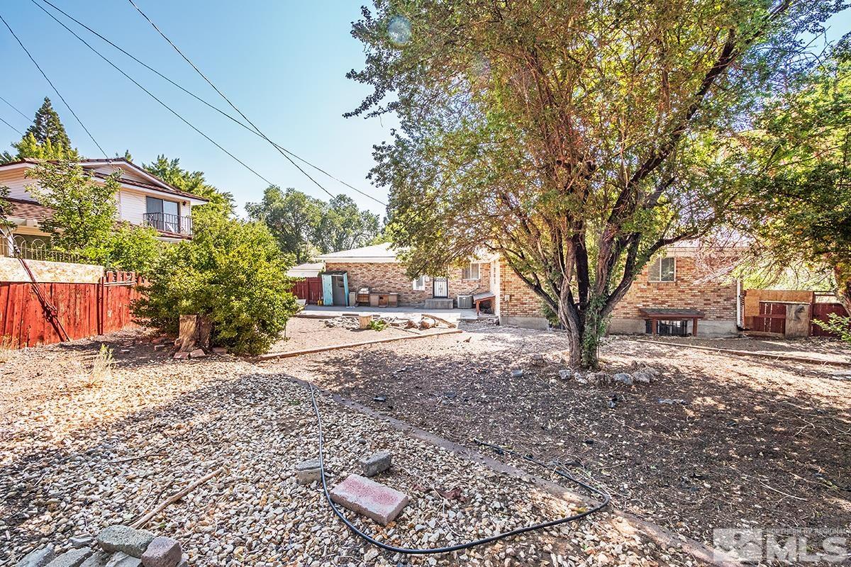 735 Brookfield Drive Reno, NV 89503 - Photo 23 of 23 a tree in the middle of a yard