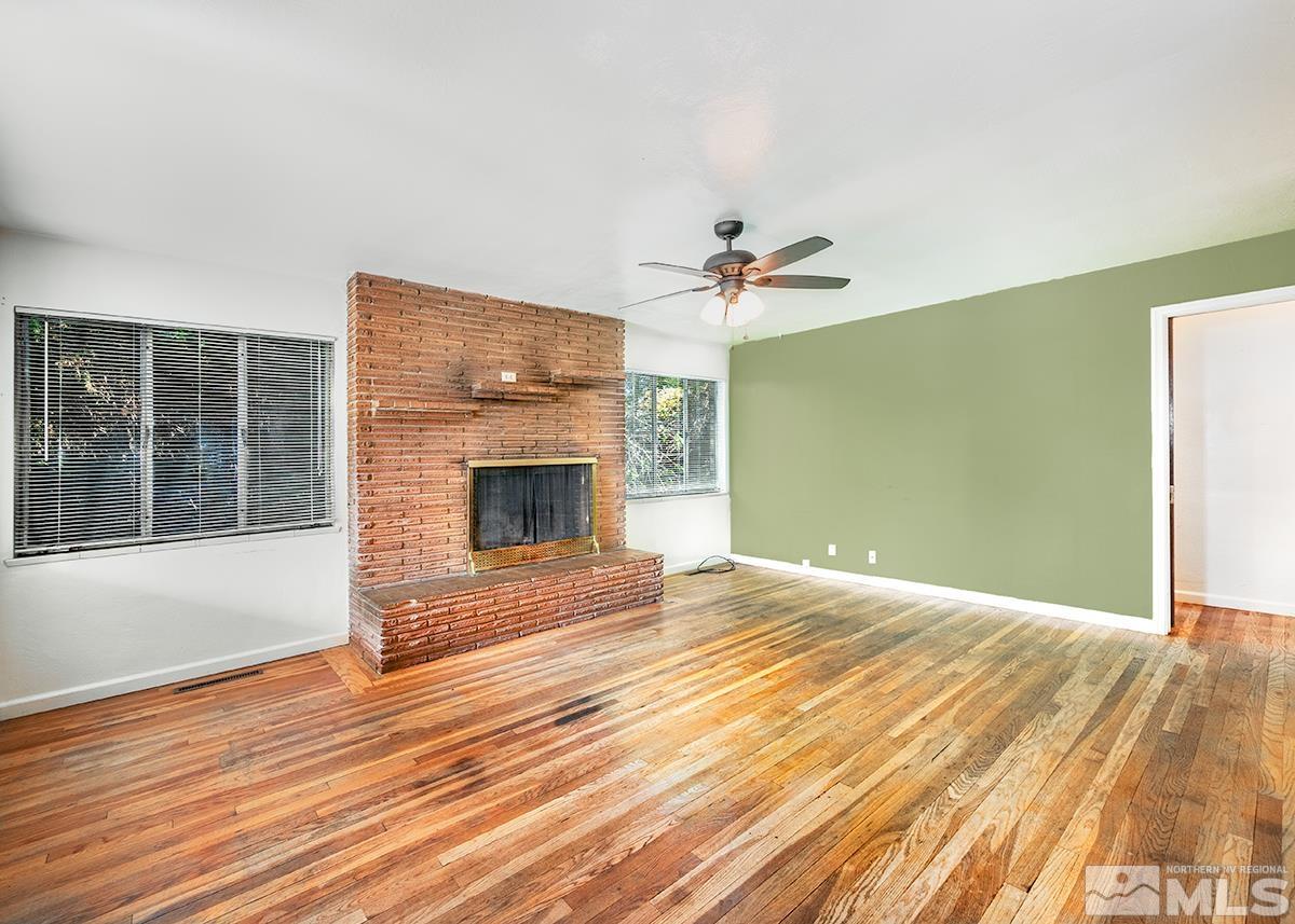 735 Brookfield Drive Reno, NV 89503 - Photo 3 of 23 a view of empty room with wooden floor and fan
