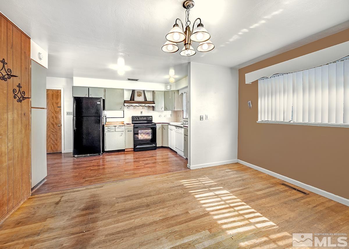735 Brookfield Drive Reno, NV 89503 - Photo 5 of 23 a view of a kitchen with a stove cabinets and wooden floor
